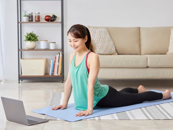 H4 A laptop on a yoga mat, facing away from the camera